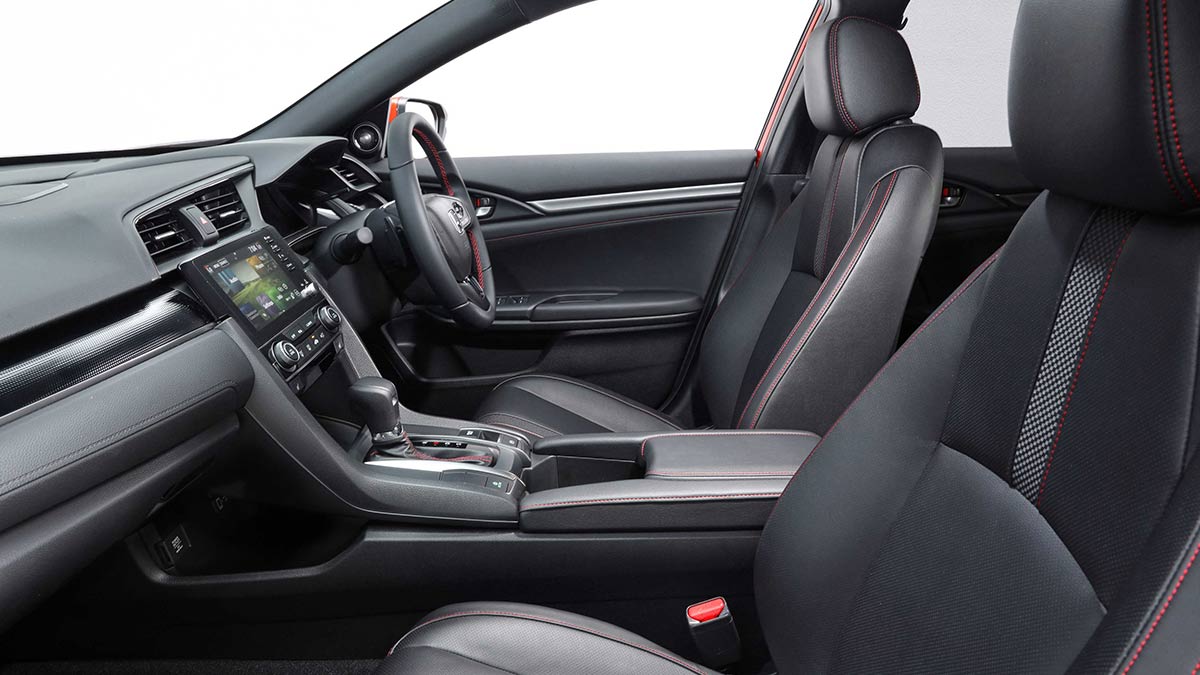 Dark grey interior of the Honda Civic RS hatch 2020 car showing the front seats and dashboard