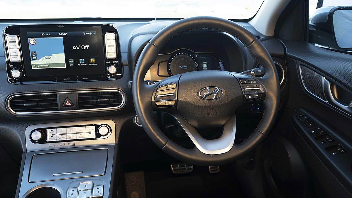 Grey interior of the Hyundai Kona showing the steering wheel and centre console