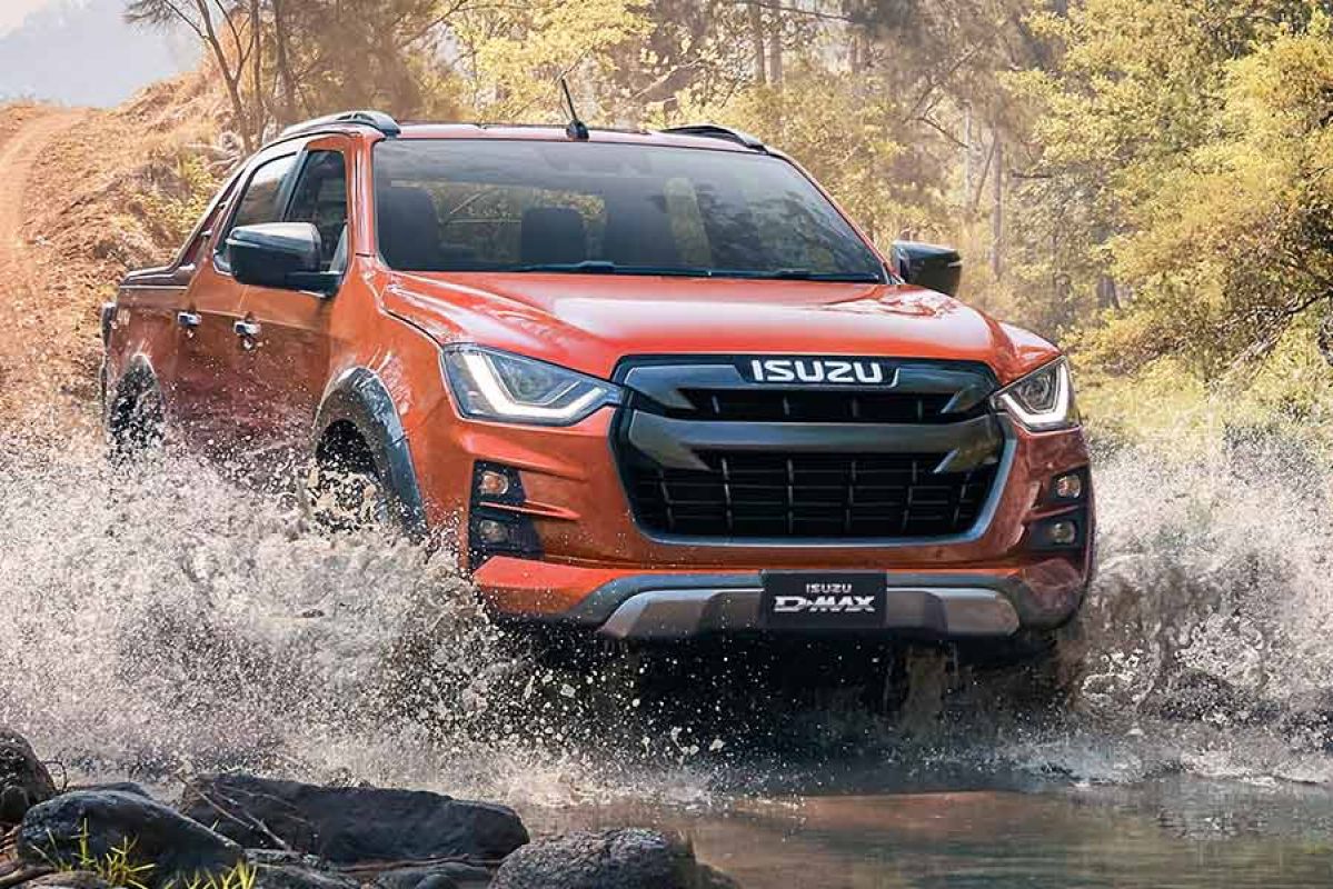 The 2022 Isuzu D-Max X-Terrain splashing through a water crossing.