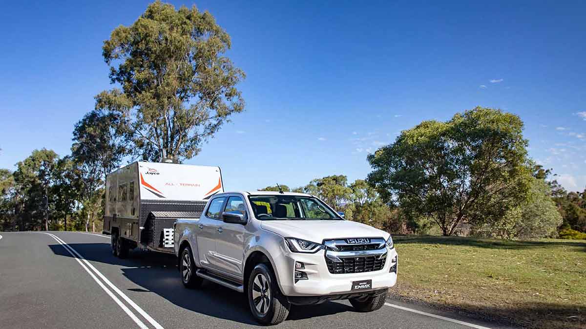 White Isuzu D-Max towing caravan