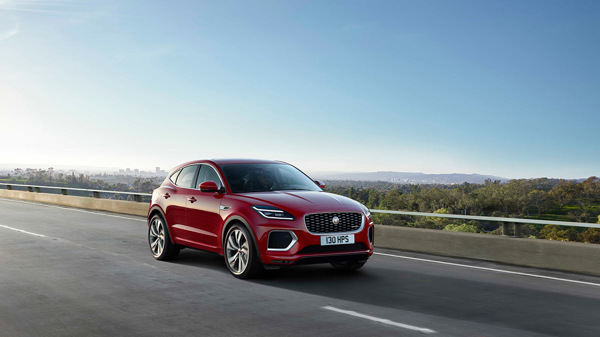 A red Jaguar E-pace SUV on the road