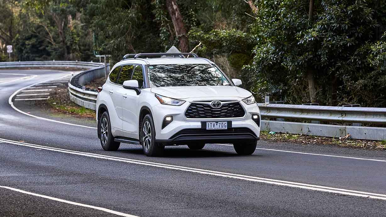 White Toyota Kluger driving