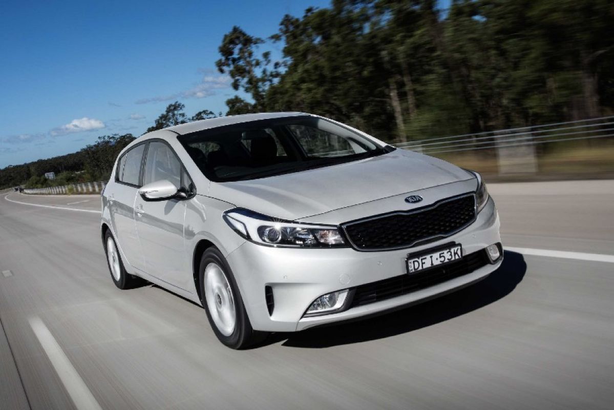 silver kia cerato s premium driving on road