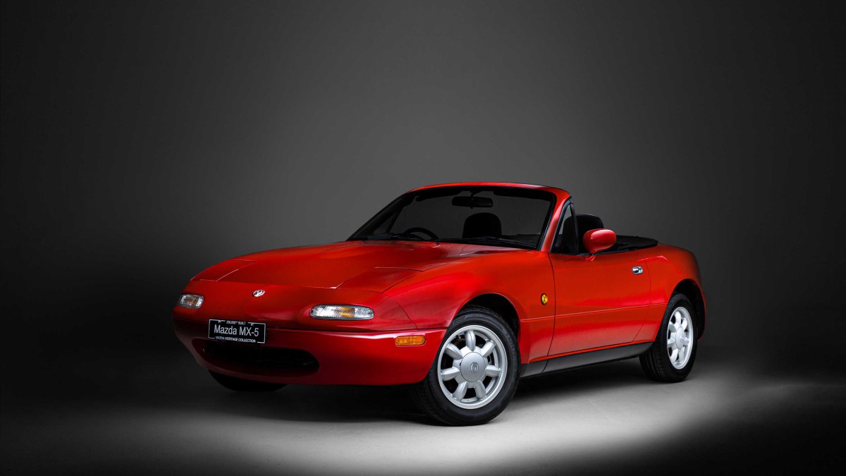 A red convertible Mazda MX-5