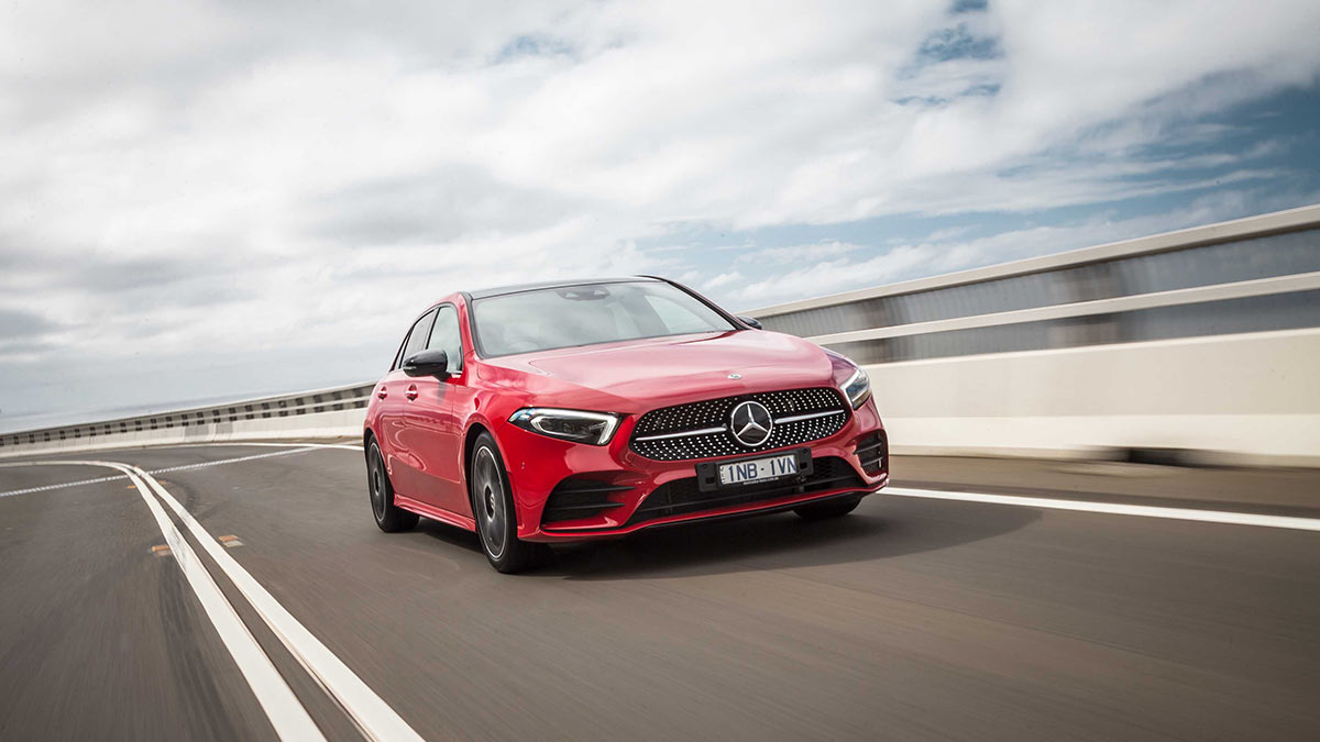 Front side view of a red Mercedes-Benz A250 4Matic in motion