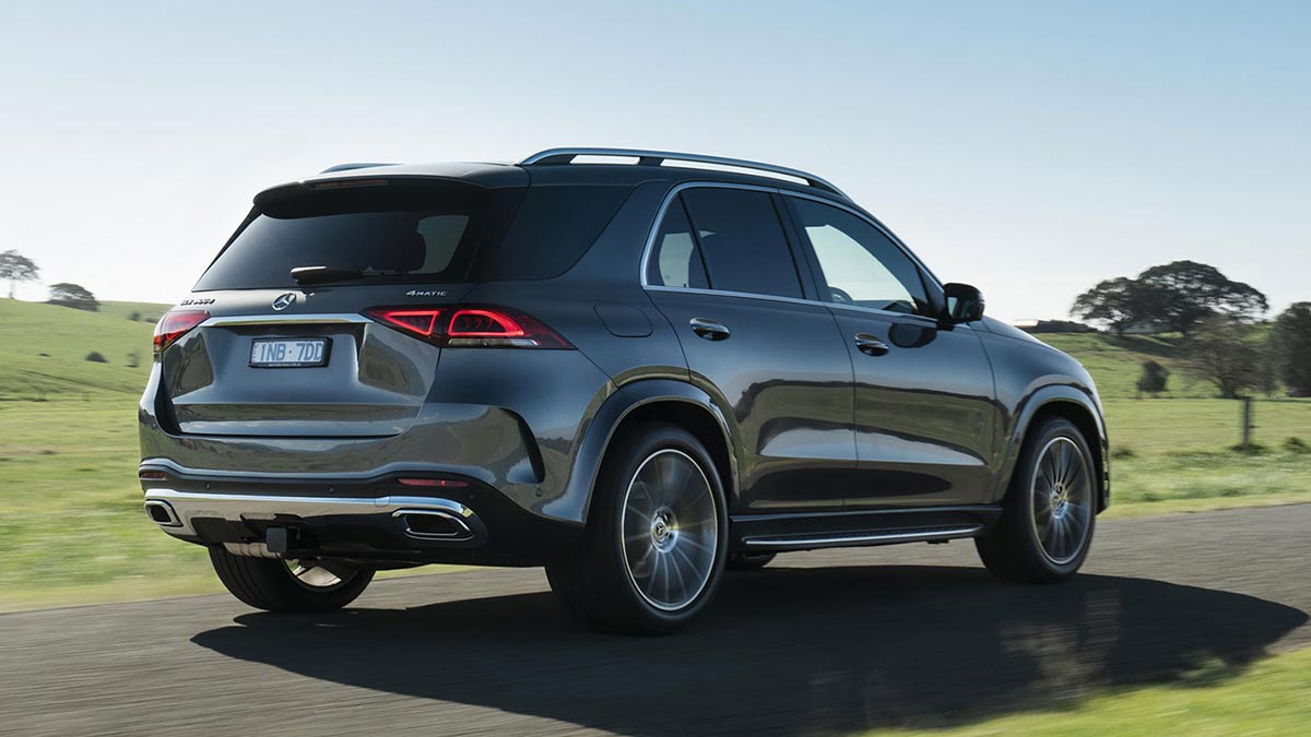 Rear side view of a grey Mercedes-Benz GLE300d in motion