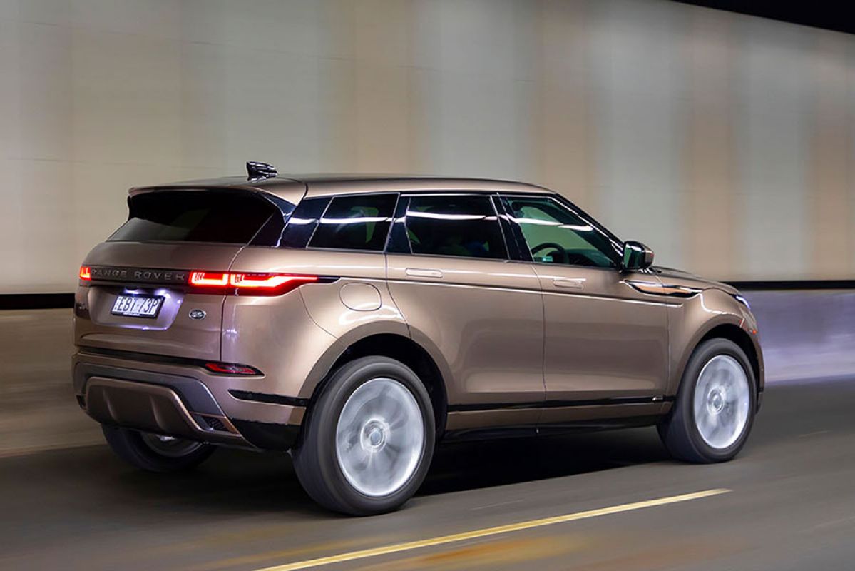 Side view of Range Rover Evoque driving through a tunnel 