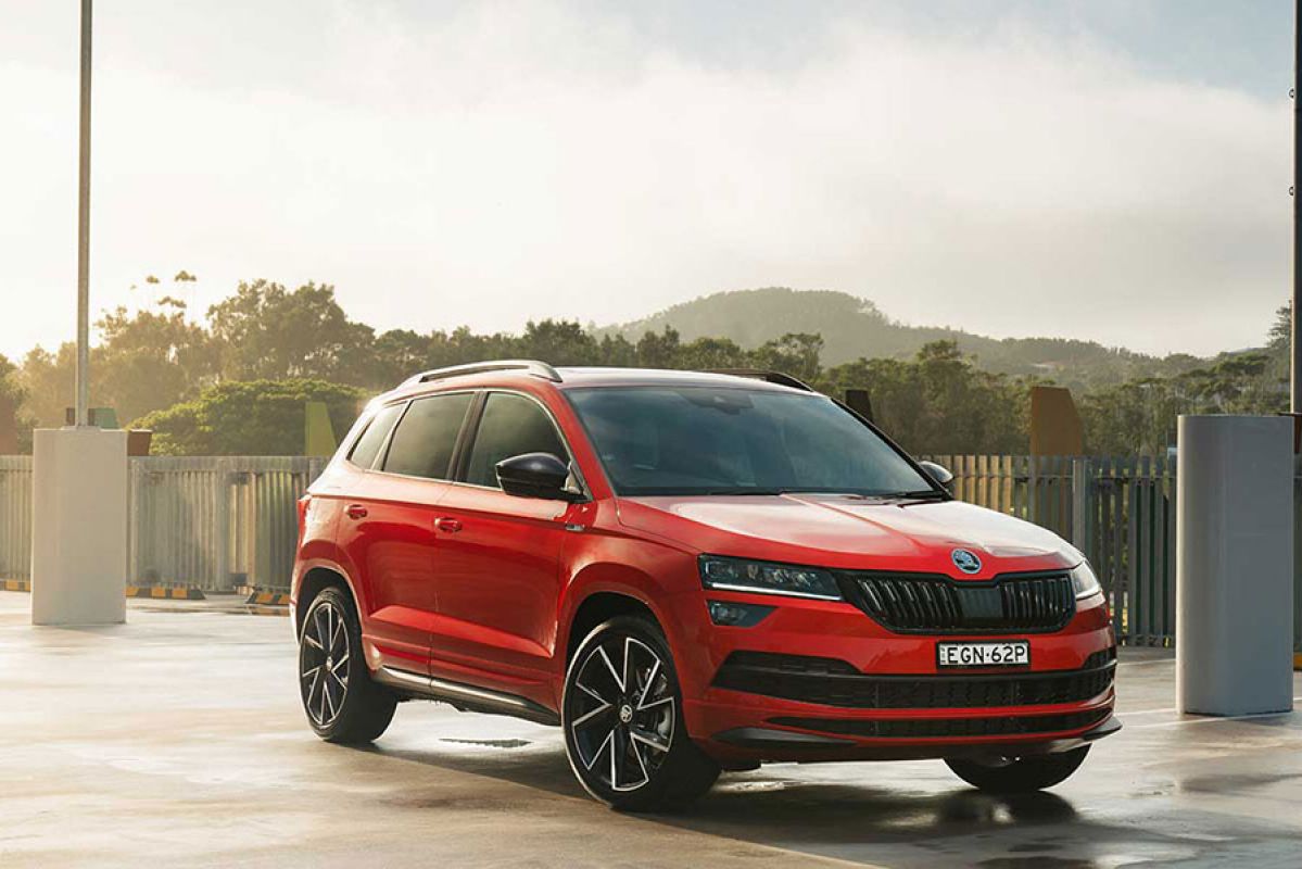 Red Skoda Karoq 140TSI Sportline parked in outdoor car park