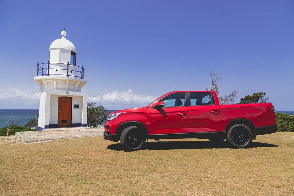 A red SsangYong Musso XLV Ultimate parked at Ballina Lighthouse