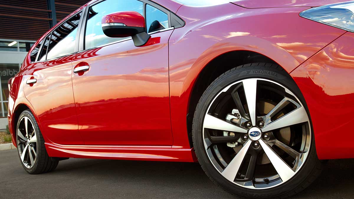 Close up view of the Subaru Impreza's front wheel and side panel