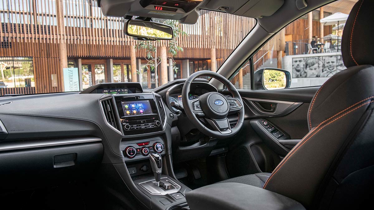 Dark grey interior of the Subaru XV Hybrid 2020 showing the dashboard and steering wheel