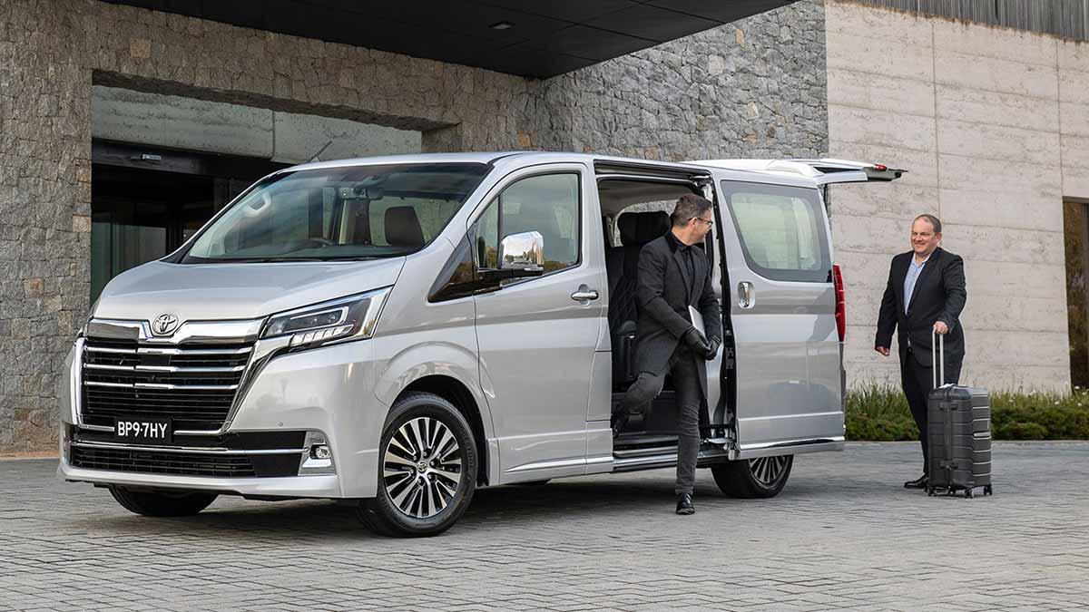 Passenger walking out of the Toyota Granvia 