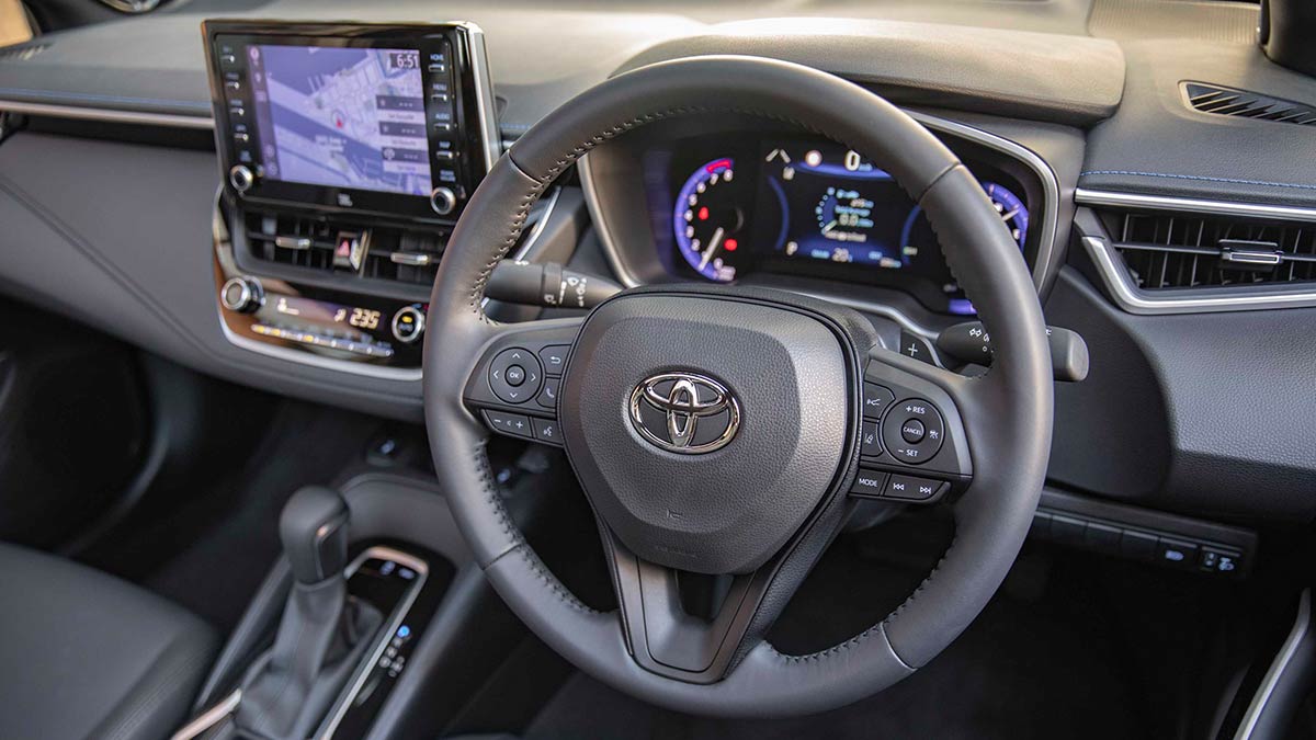 Grey interior of the 2019 Toyota Corolla showing the centre console and steering wheel