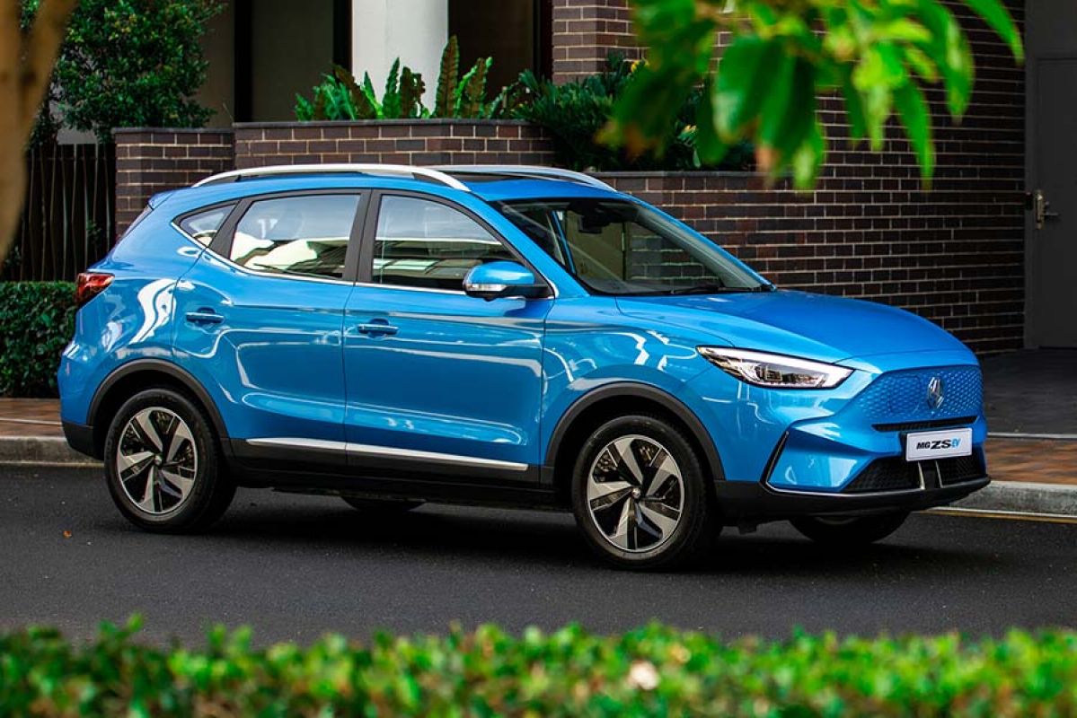 Blue MG ZS Electric car with greenery in foreground