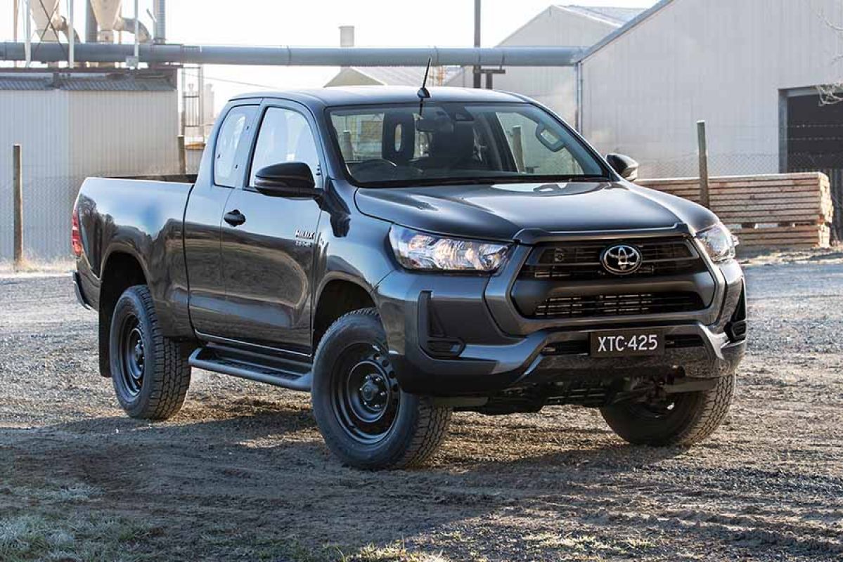 Grey Toyota Hilux parked at timber yard