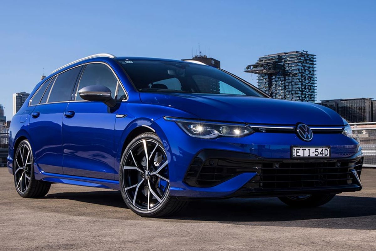 A blue Volkswagen Golf R wagon on a rooftop carpark.