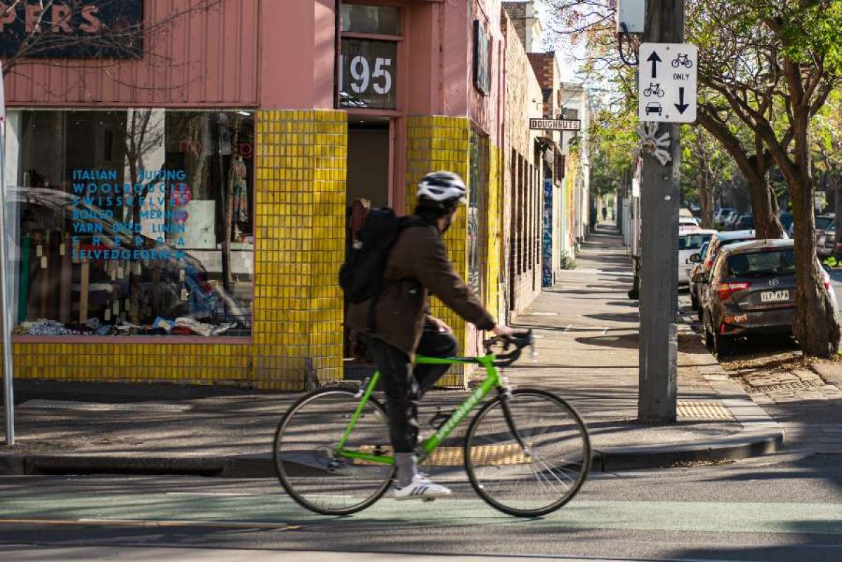 Man riding bicycle in Fitzroy