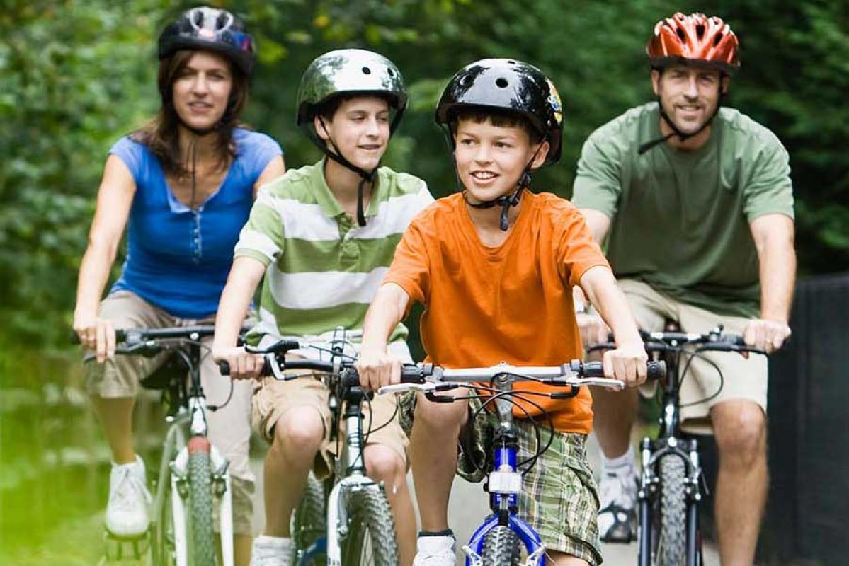 Family of four riding their bikes 