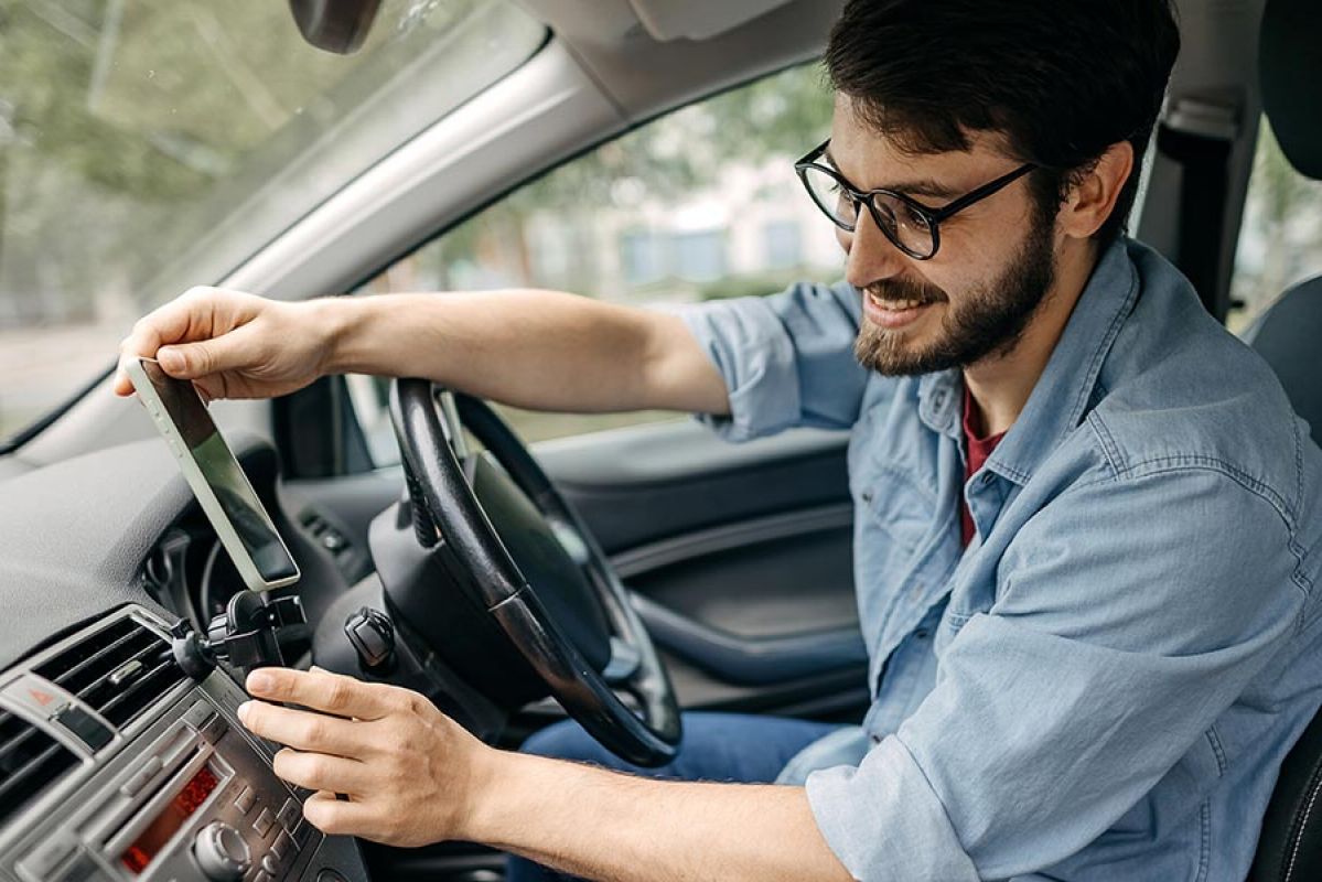 Person in car mounting mobile device