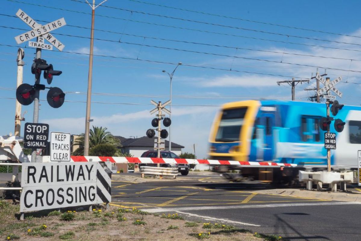 A Melbourne metro train going over a level crossing