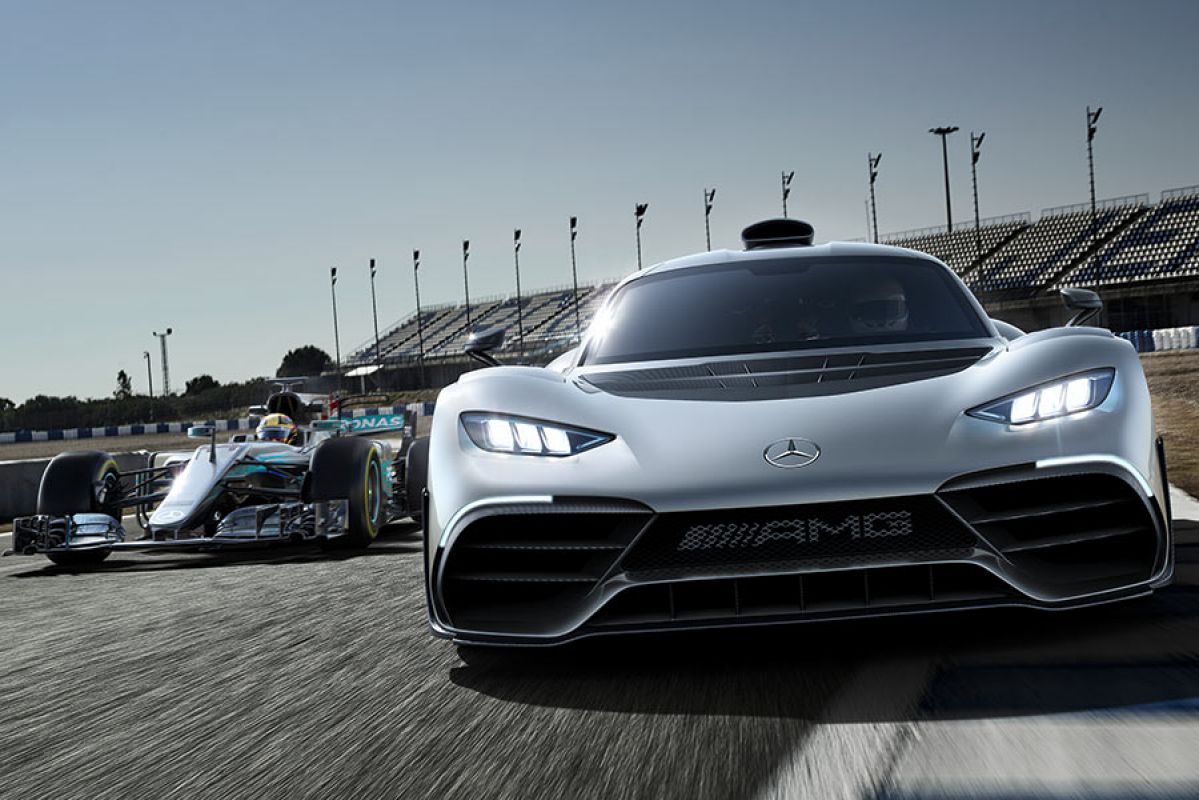 A Mercedes-AMG F1 racecar on the track with the Project One hypercar.