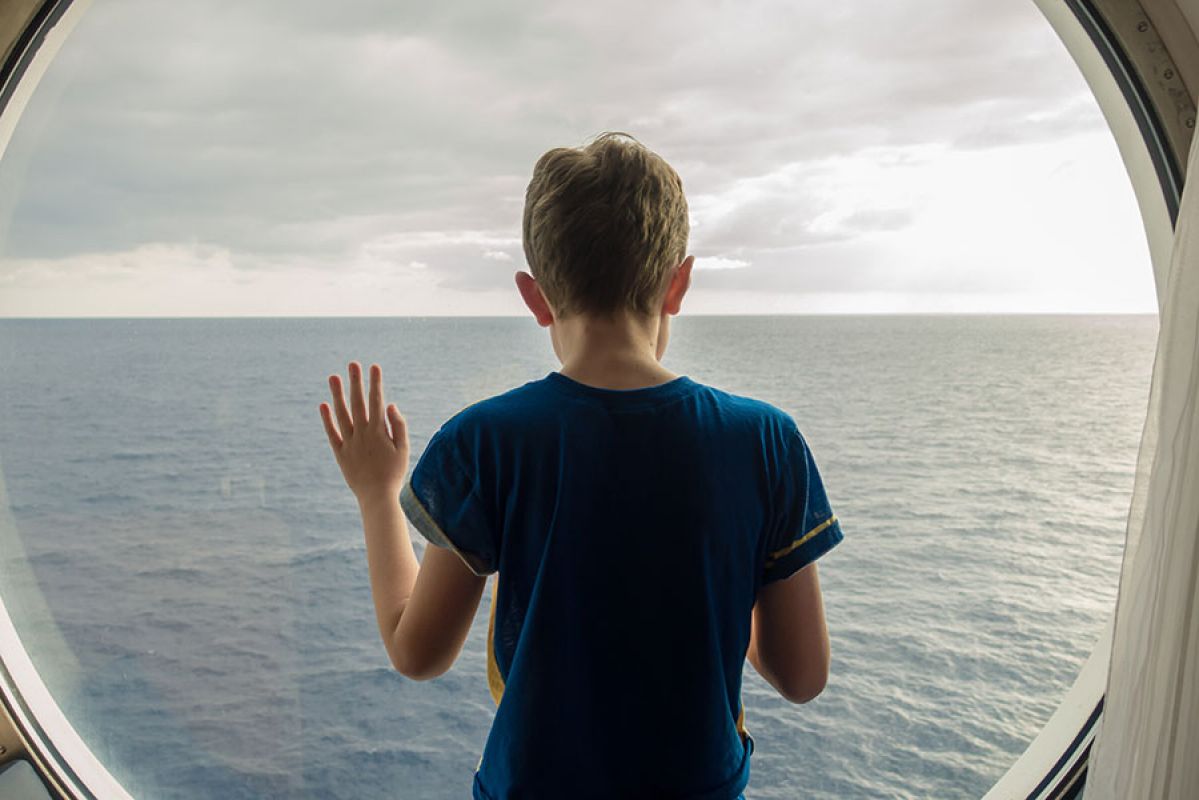 boy feeling sick on a boat