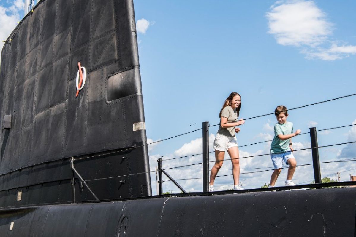 Two children playing on the submarine in Holbrook