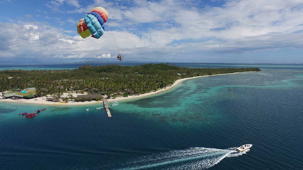 sky diving over islands and the ocean. 