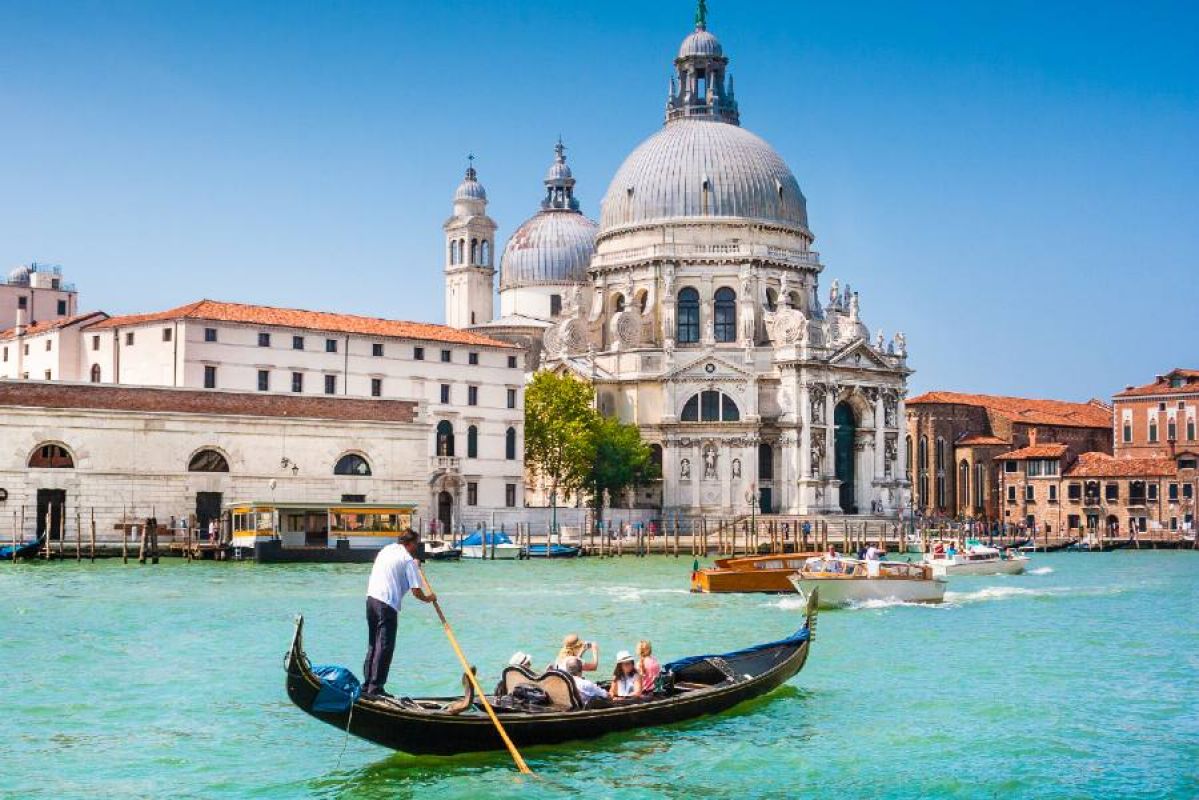 A gondola on crystal blue waters in Venice, Italy