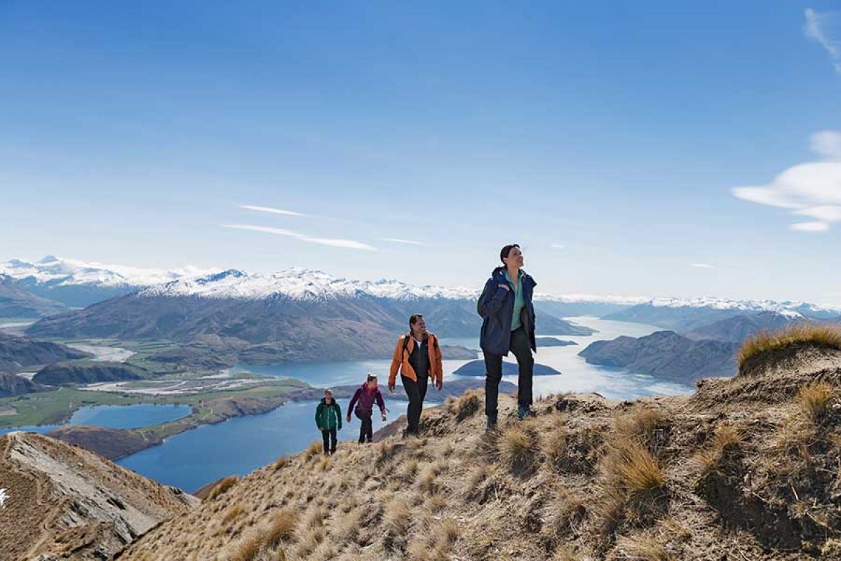 family walking up mountains