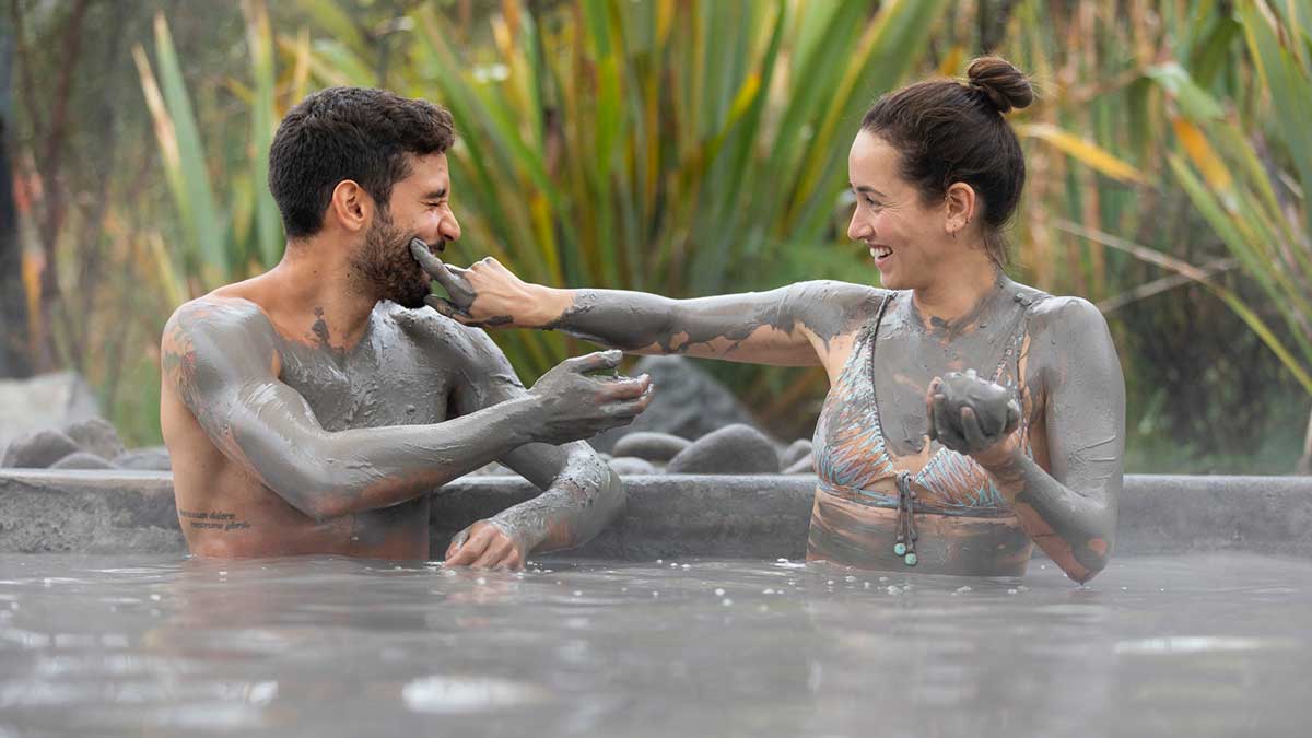 Couple bathing in mud Pool and hot spring