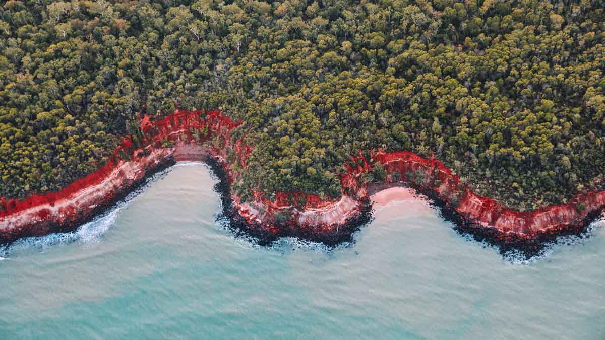 Aerial view of Rainbow Beach at Tiwi Islands. Image: Tourism NT/Elise Cook