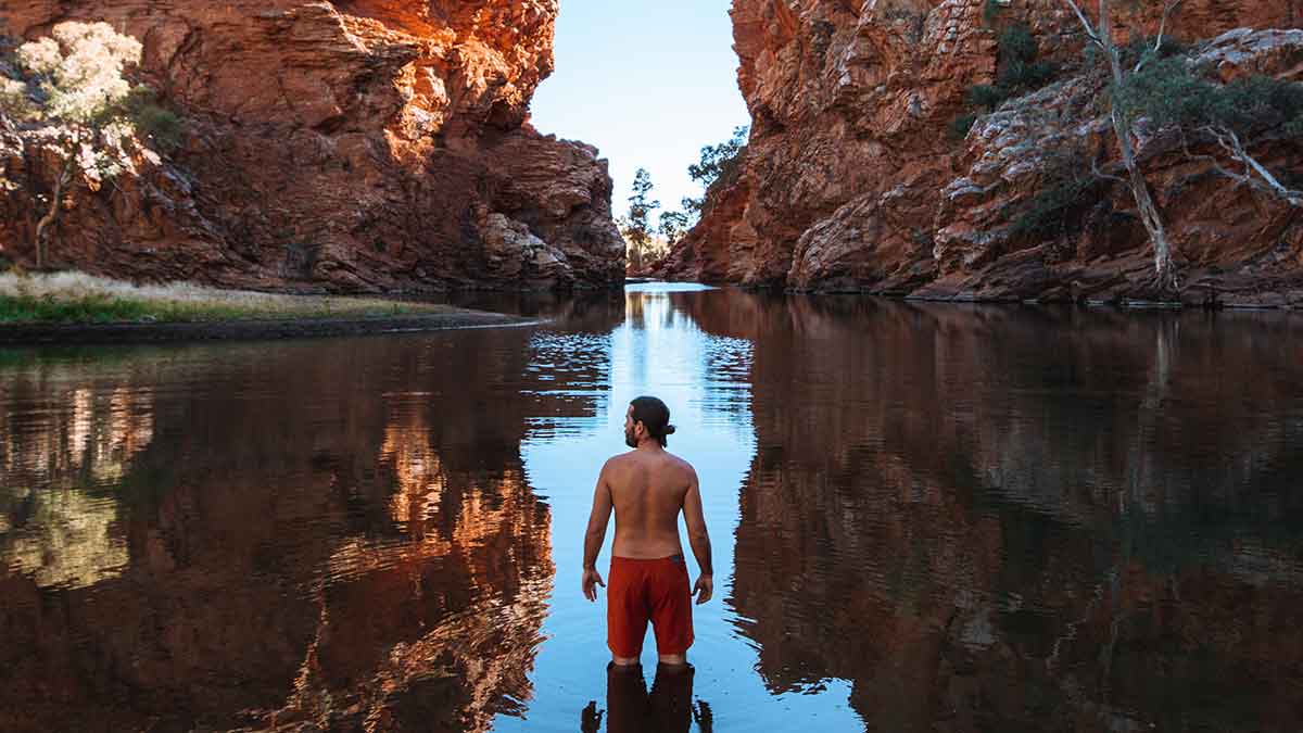 Man standing at Ellery Creek Big Hole