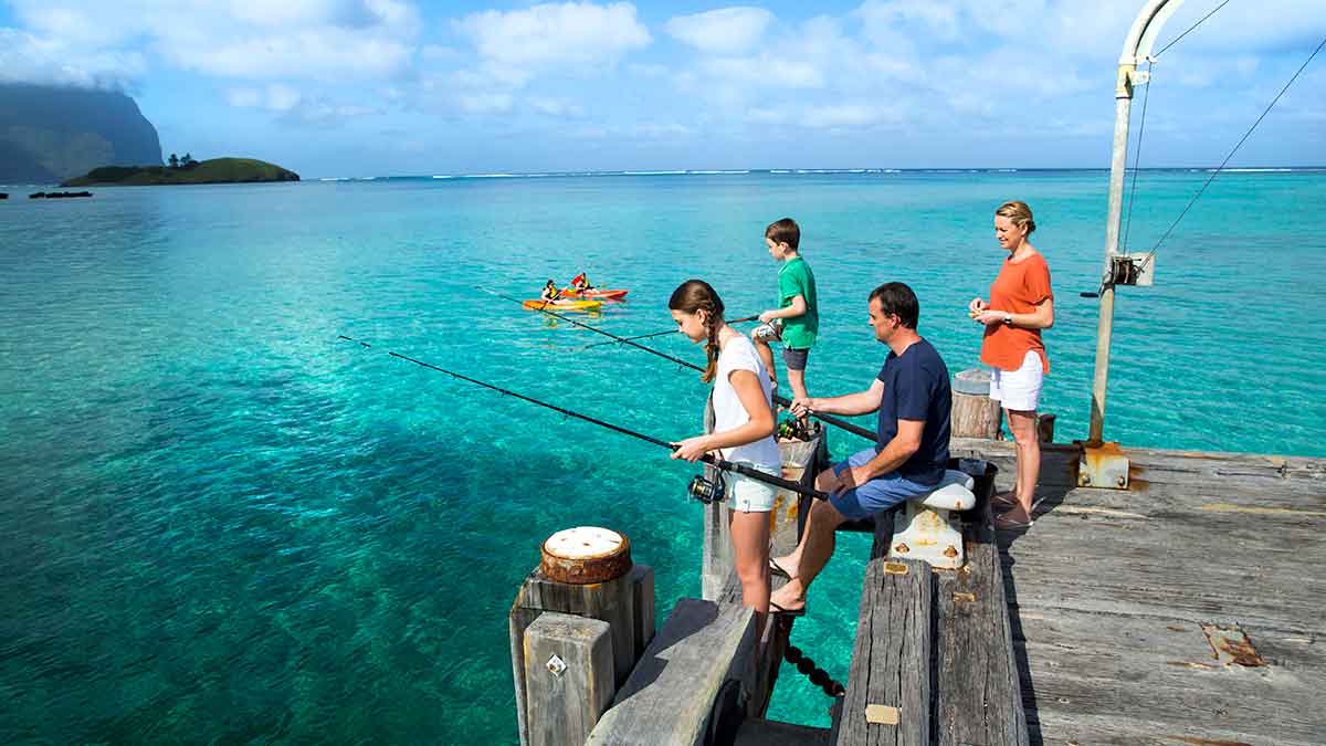 Family fishing off a jetty