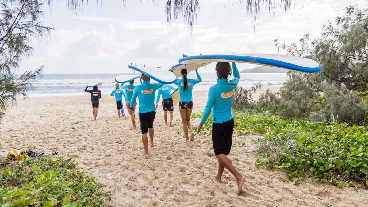 Surfers getting in the water