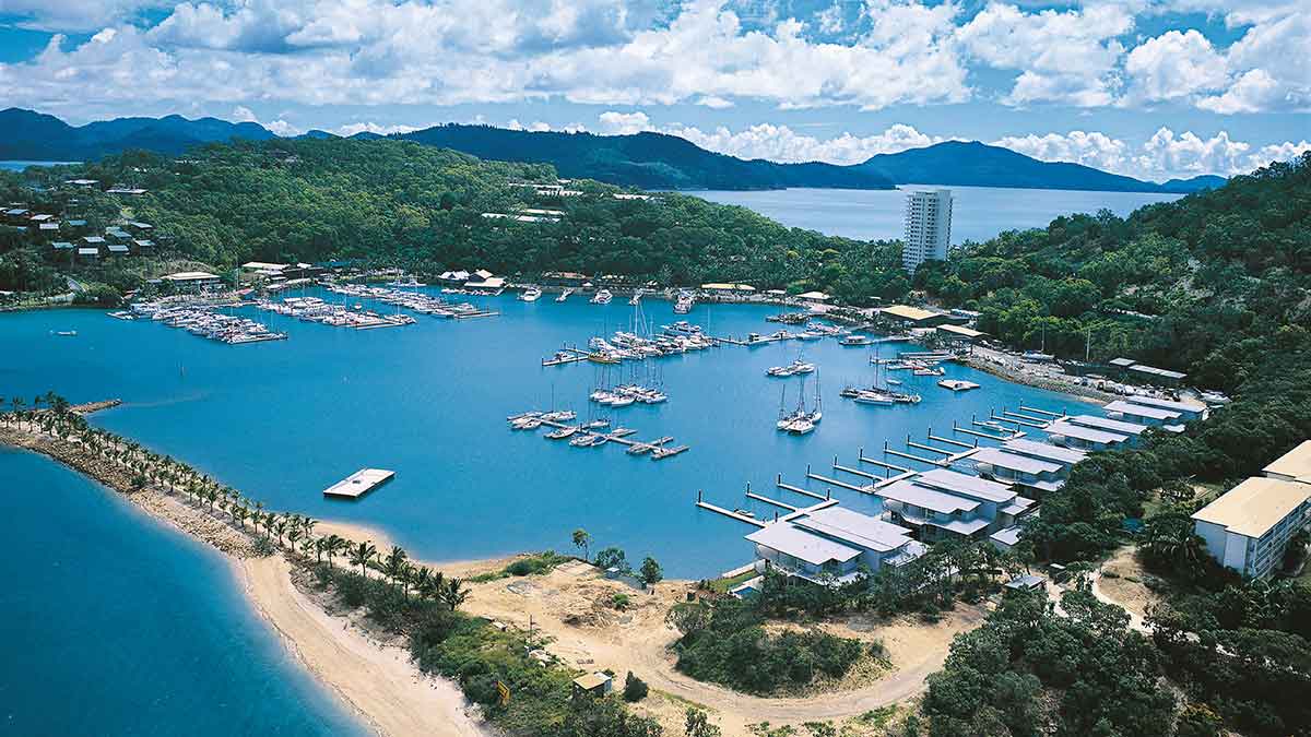 Boats docked all around a lagoon