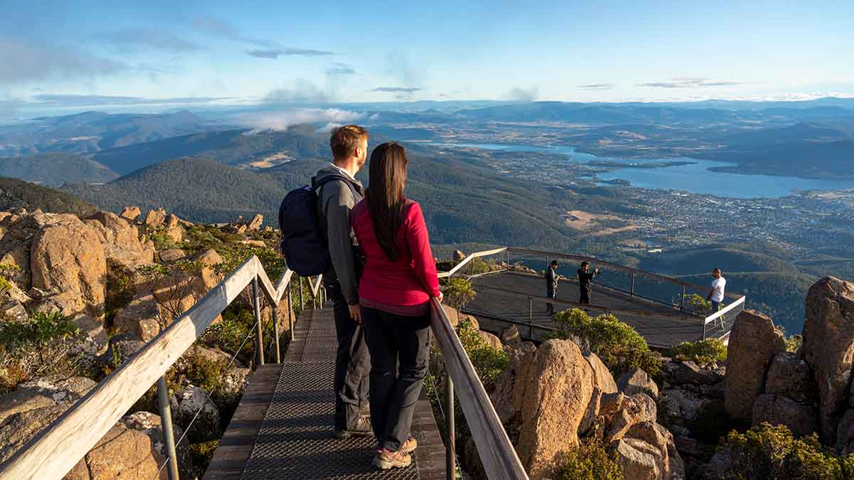 two people looking over the mountain tops