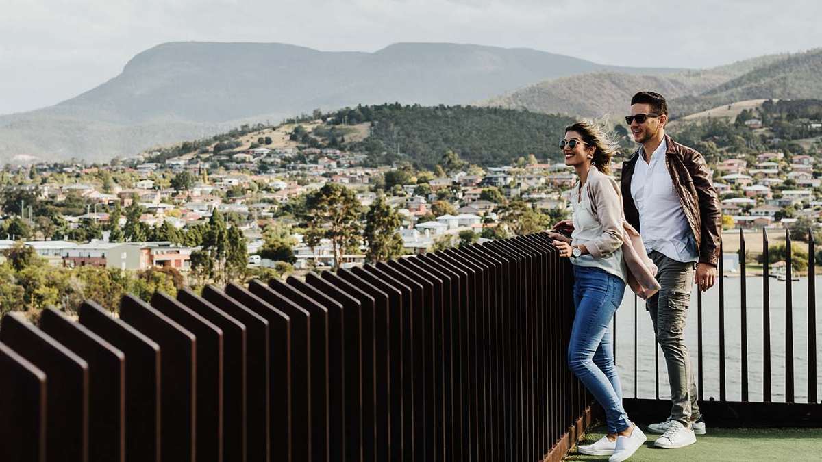 Couple at view looking out over rails