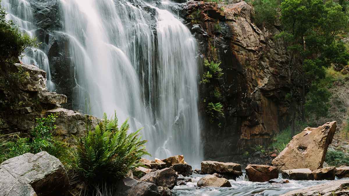 waterfall running down a mountain