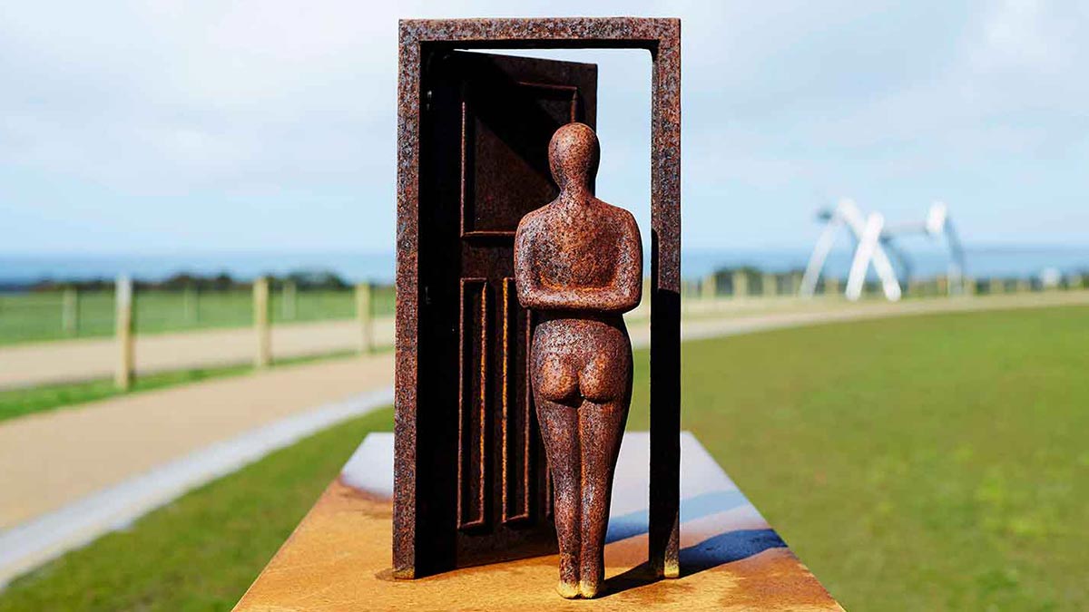 Art scuplture of man and door at Point Leo Estate Sculpture Park