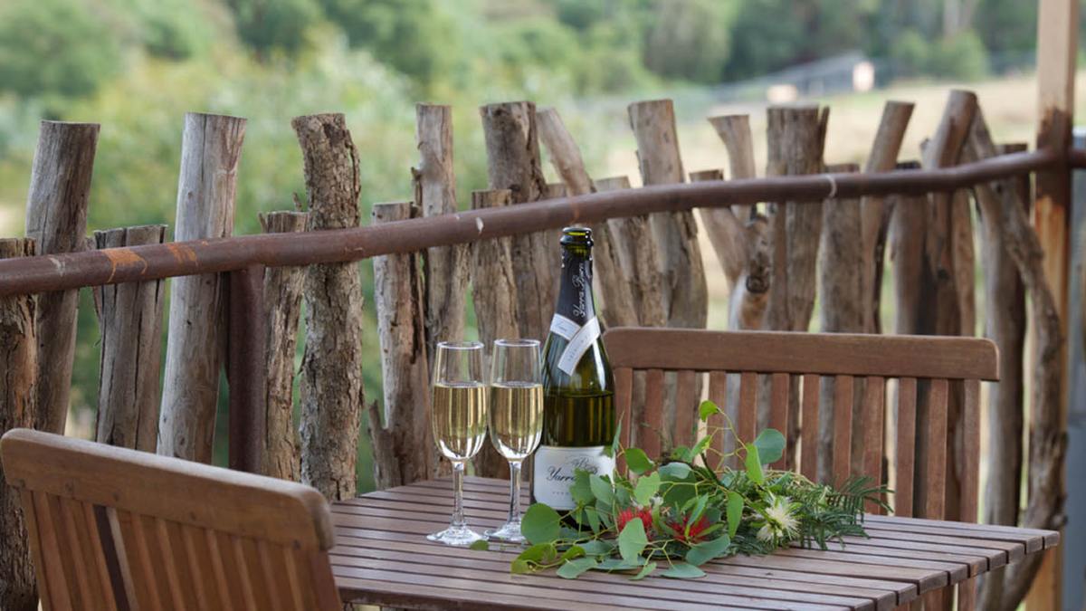 Outdoor table with champagne and glasses