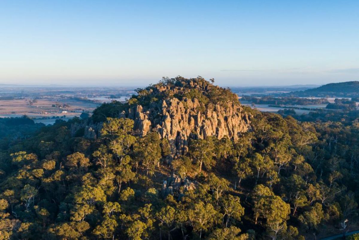 A drone shot of Hanging Rock at sunset