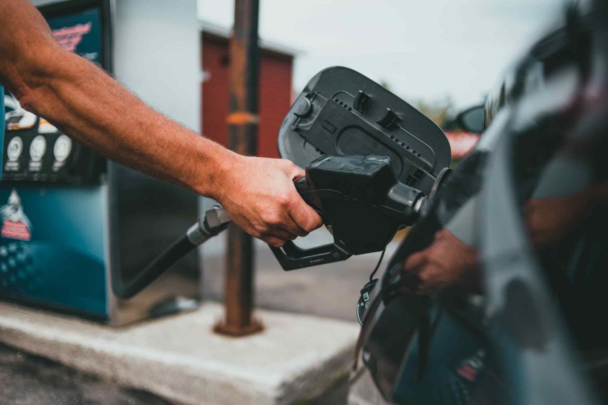 man fuelling car at petrol station