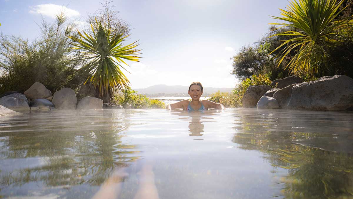 Woman in hot springs New Zealand. 