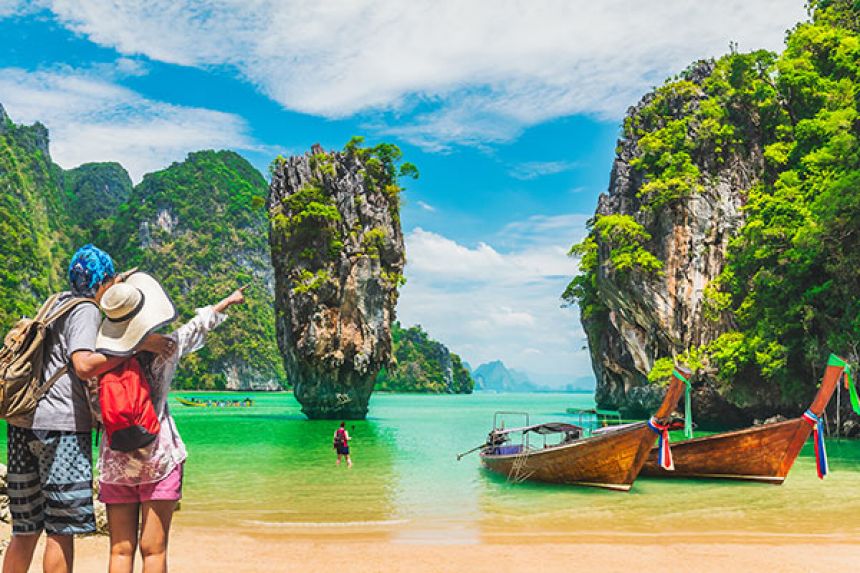 Group of people looking at natural wonders from a beach