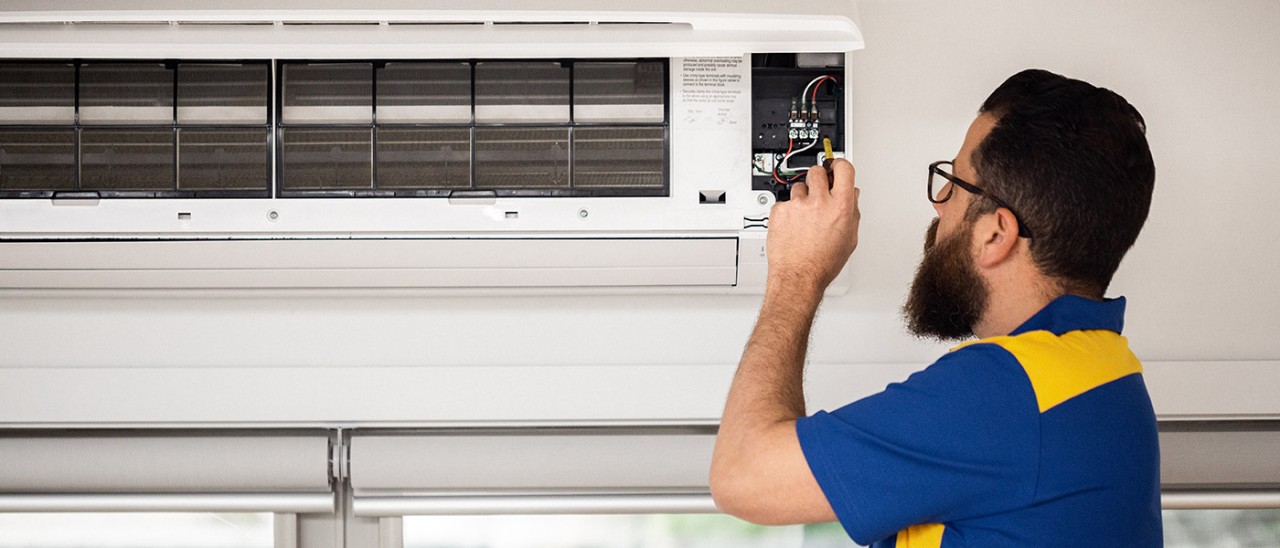 RACV-air-conditioner-015-1400x600.jpg Qualified tradesperson fixing split system air conditioner
