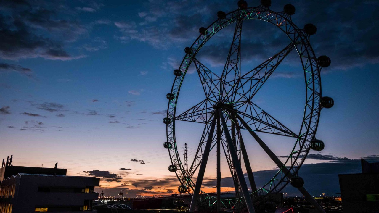 The Melbourne Star observation wheel at dusk with all its lights off for Earth Hour