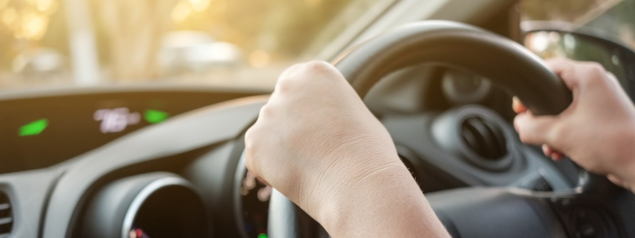 Hands on a steering wheel
