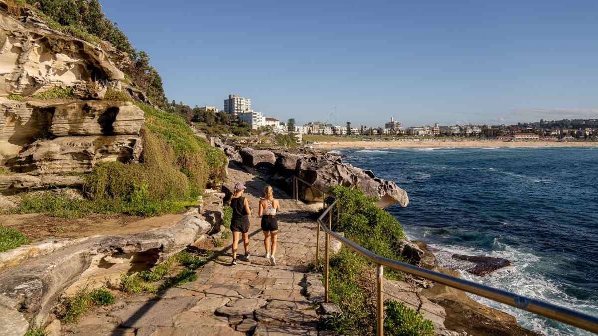 two women on a seaside walk in Sydney's Tamarama suburb