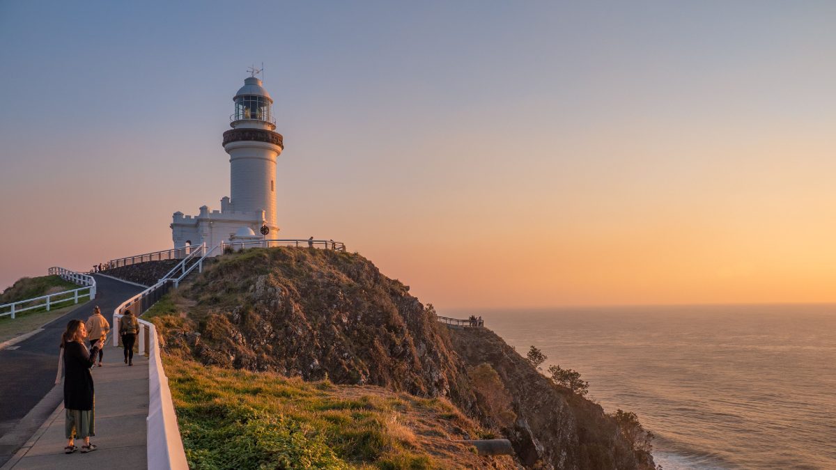 Byron Bay lighthouse with people walking towards it